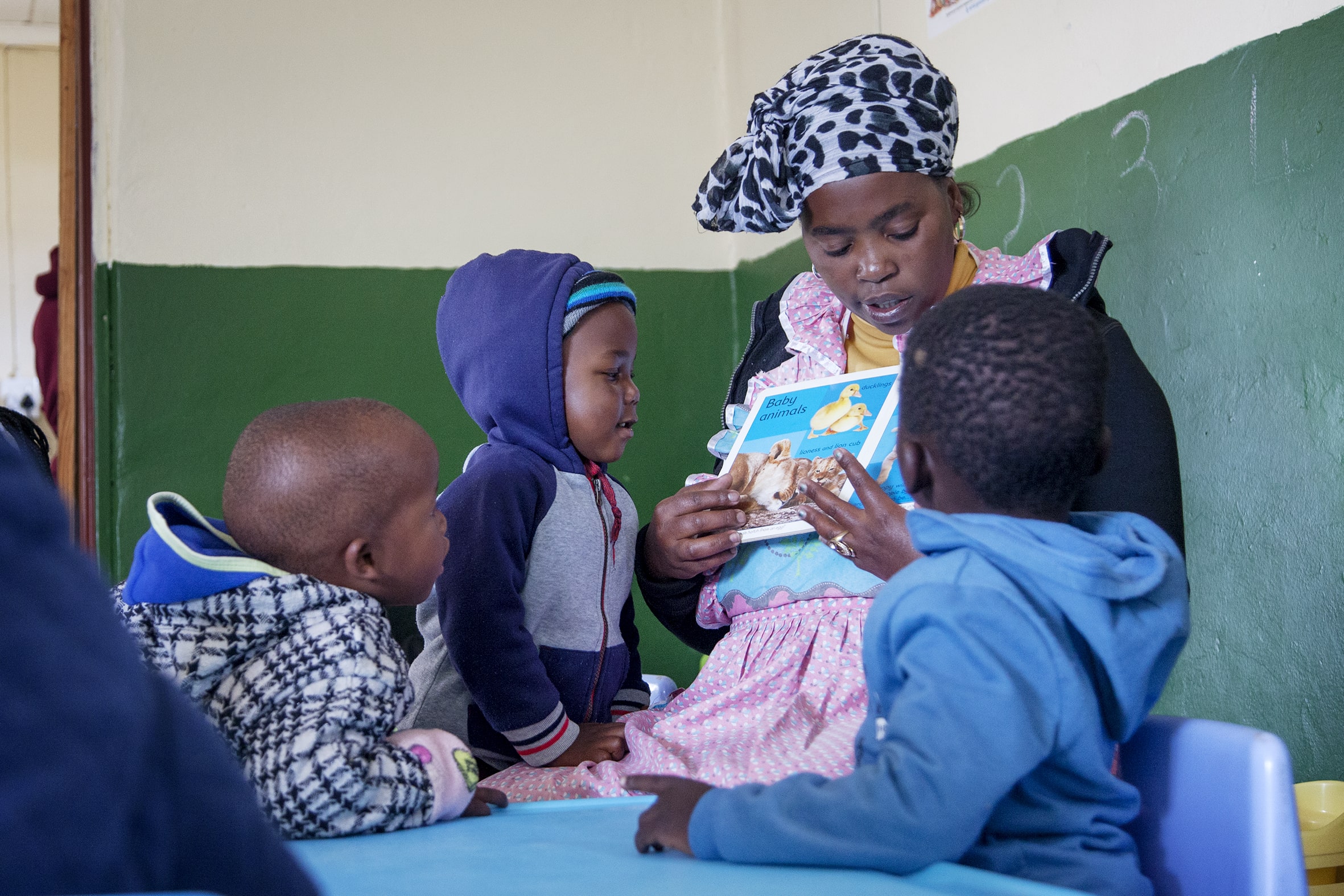 http://Teacher%20reading%20to%20children